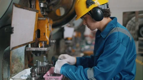 Worker wears hard hat and ear protection Stock Footage 338066191