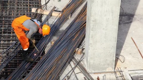 Worker weld metal gratings by acetylene torch Stock Footage