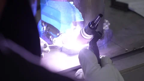 Worker welder tig welding titanium metal Stock Footage 256151412