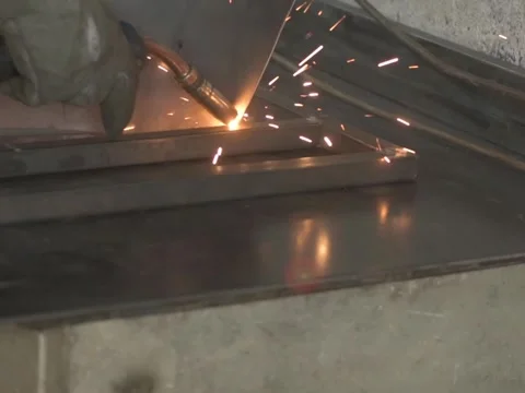 A Worker, welder in work clothes, construction gloves, Stock Footage 255134168