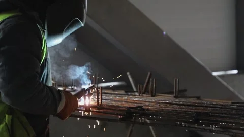A worker welding the armature Stock Footage 131180146