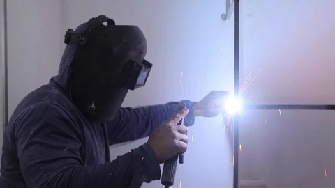 Worker welding a dressing room in a home renovation Stock Footage 150913708