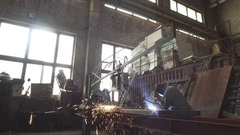Worker welding iron wearing welding mask Stock Footage 86117616