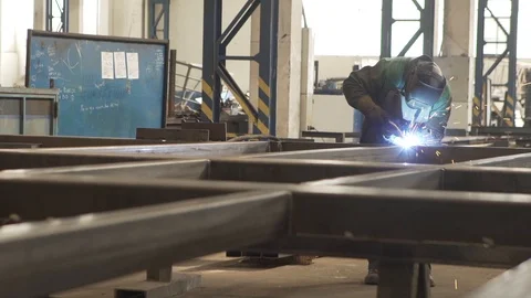 Worker welding metal in daylight | mid shot Stock Footage 86054640