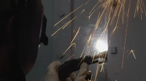 Worker welding a metal door Stock Footage 67554082
