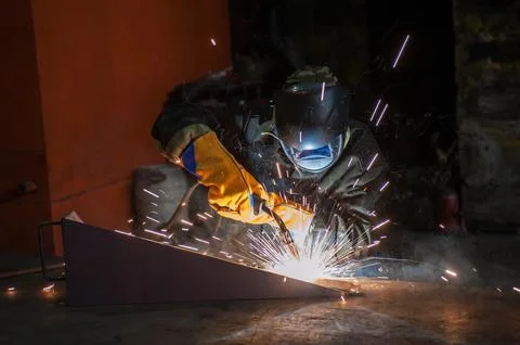 Worker welding metal Stock Photos