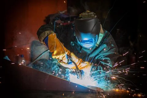 Worker welding metal Stock Photos
