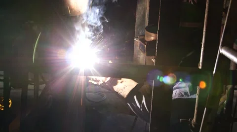 Worker Welding Metal With Sparks Stock Footage 63988376
