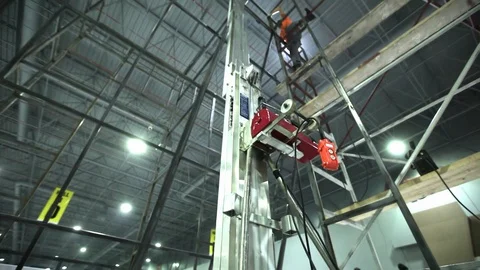 Worker welding metal with welding machine Stock Footage 128928960