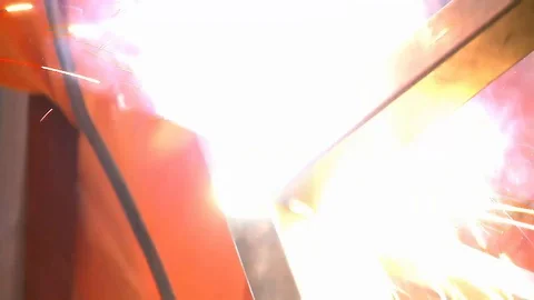 Worker welding metal with welding machine Stock Footage 128929120