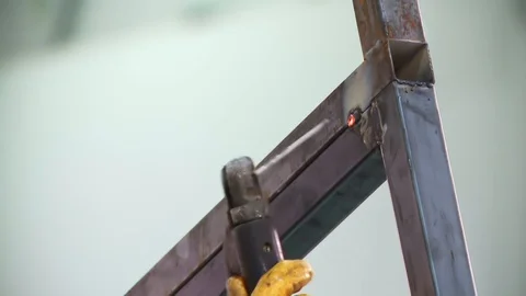 Worker welding metal with welding machine Stock Footage 128929278