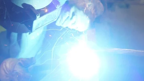Worker welding steel with mig welder machine slow motion Stock Footage
