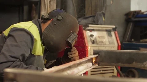 Worker welding steel with mig welder machine slow motion Stock Footage