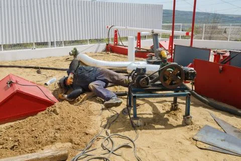 Worker welding the steel part by manual Stock Photos