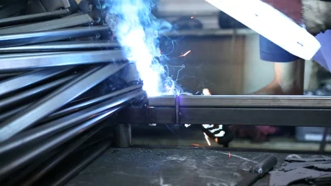 Worker Welding Steel with Sparks Stock Footage 340109054