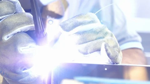 Worker welding steel using TIG welder, close up Stock Footage 93142598