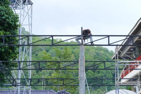The worker is welding the structure of the building Stock Photos