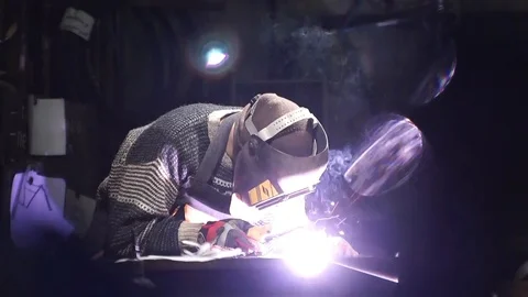Worker welds an iron pipe Stock Footage 126932413
