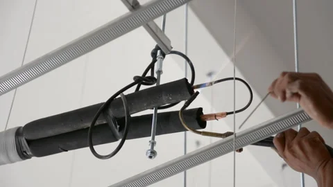 Worker welds joint of copper pipe air conditioner Stock Footage 277564865