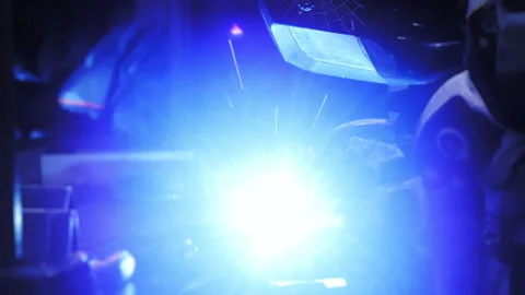 Worker welds metal. Closeup of a welding machine in work. Stock Footage 273579501
