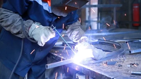 Worker welds metal Stock Footage 97730825