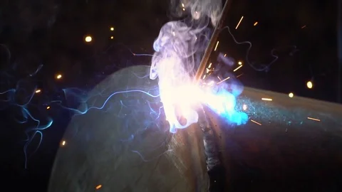Worker welds a metal pipe Video stock 111408766
