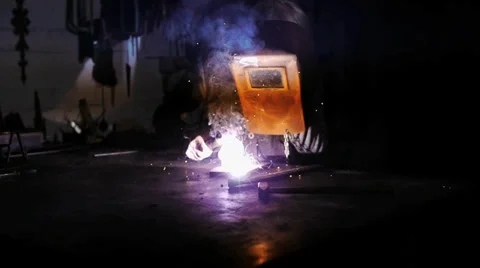 A worker welds in a old Workshop -  mystical atmosphere 動画素材 39550495