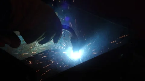 A worker welds a part inside a product Stock Footage 285037662