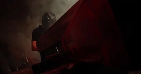 The worker welds the parts. The electrode of the welding machine touches the Video stock 167370296