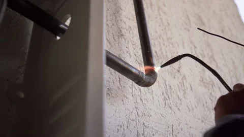 Worker welds pipe gas welding Stock-Footage 171660102