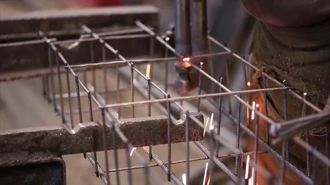 Worker welds reinforcement construction with spot welding closeup Stock Footage 70208166
