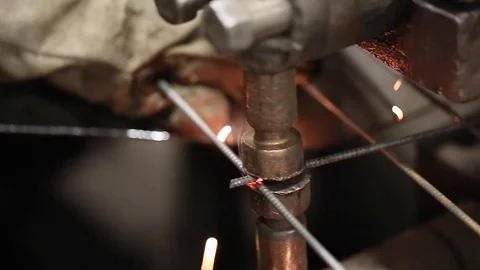 Worker welds reinforcement construction with spot welding closeup Stock Footage 70208396