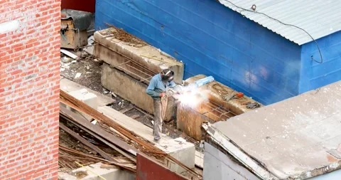 The worker welds a reinforcing structure for installation Stock Footage 137086615