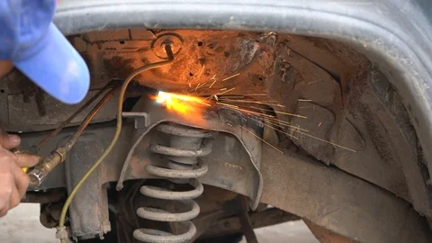 Worker Welds Vehicle Stock Footage 107636019