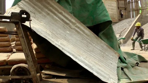 Worker with wheelbarrow on a site Stock Footage 80847552