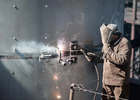 Worker while doing a industrial welding outdoor Stock Photos