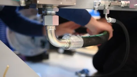 Worker who assembles hydraulic components Stock Footage 125797518