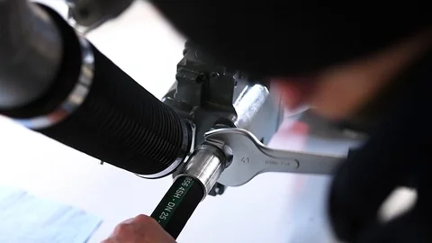 Worker who assembles hydraulic components Stock Footage 125798461