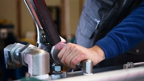 Worker who assembles hydraulic components Stock-Footage 125798525