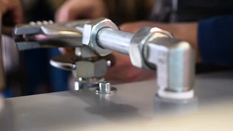 Worker who assembles hydraulic components Stock Footage 125798879