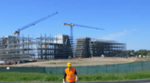 Worker who comes out of the yard and puts his helmet Stock Footage 63144191
