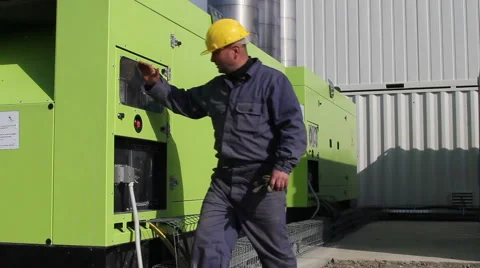 Worker who operates two powerful diesel generators Stock Footage 56293415