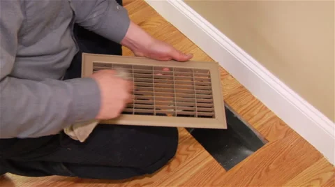Worker wipes down vent cover and opening Stock Footage 42961167