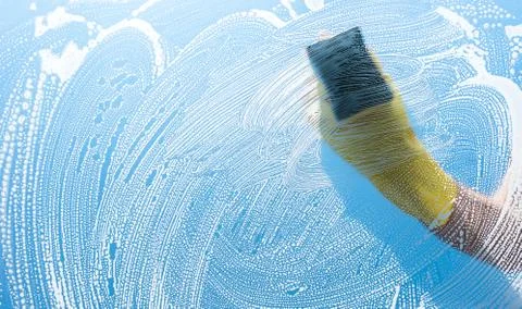 Worker wipes a window Stock Photos