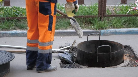 A worker is wiping a shovel with solution. Stock Footage 108063222