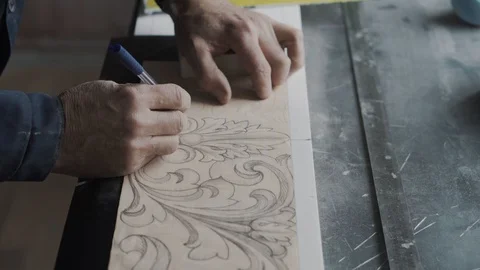 Worker without two phalanges on his arm, he traces lines on the fluted paper usi 스톡 동영상 99039194