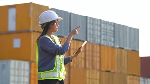 Worker woman checking and control loading containers box from cargo Stock Footage 147673063