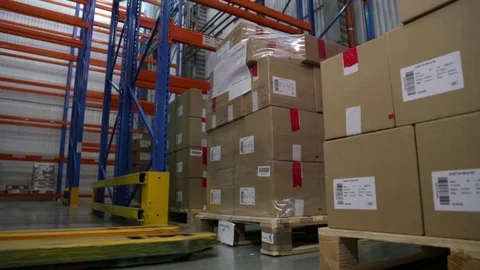 The worker in  work process of electric lift truck in warehouse Stock Footage 72665024