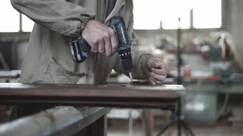 Worker at work, on a wooden window Stock Footage 73730529