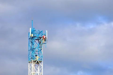 Worker working on communication tower Stock Photos